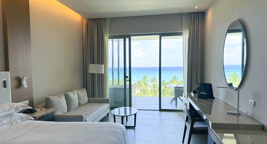 Oceanfront room with balcony hot tub at Barceló Maya Riviera during Joe Dispenza retreat.